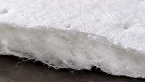 coarse fiber layers inside an oil absorbent pad