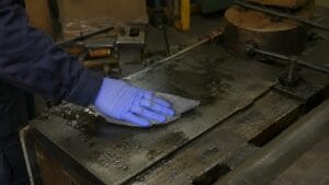 Worker using an absorbent pad